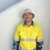 High vis yellow work shirt with custom Blue Tree pattern, a collaboration between Blue Tree Project and TradeMutt to support mental health awareness