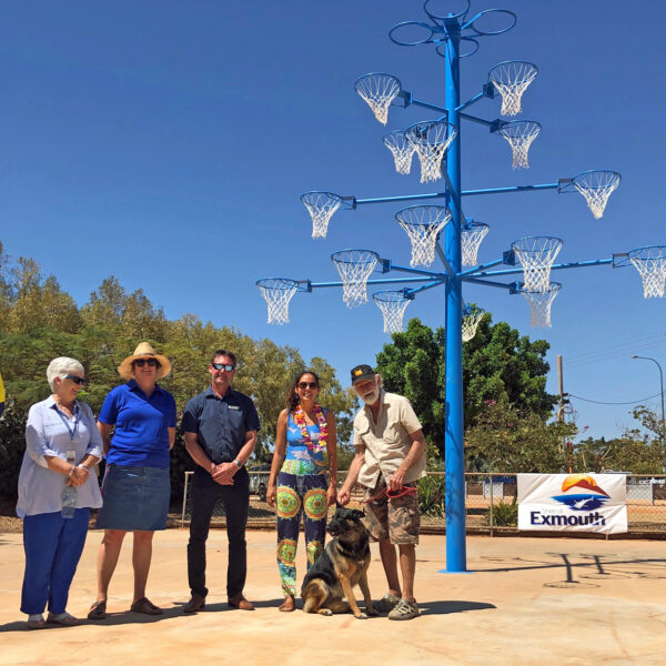 Raytheons Tom Leech, Exmouth Hospital social worker Dawn Ward, Exmouth CWA president Helen Turner, Shire of Exmouth president Matthew Niikkula, Free the Funk One Waves Zoe Gillam and Exmouth Mens Sheds Alan Duncan with the newly painted blue tree in Exmouth. Picture: Shire of Exmouth